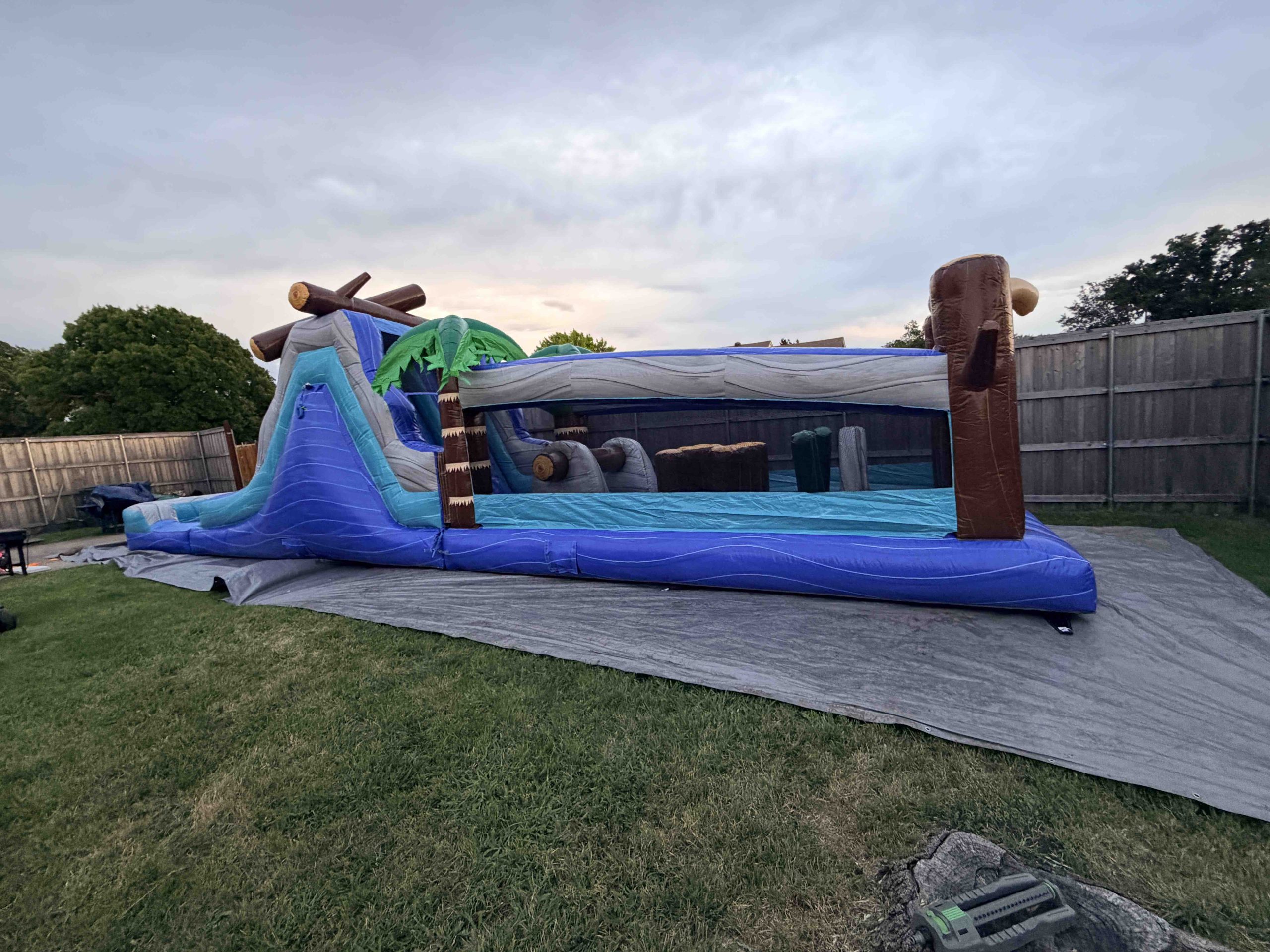 Tropical Surge 45ft Duel Lane Obstacle Run delivered and set up by InflatableTX